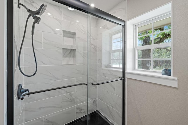 1201 County Road 229, Florence, TX 76527 - full bathroom featuring a shower stall and a textured wall
