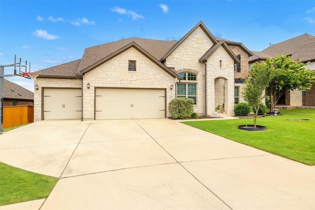 4225 Borho Ranch St, Leander, TX 78641 - french country style house with a garage, stone siding, driveway, and a shingled roof