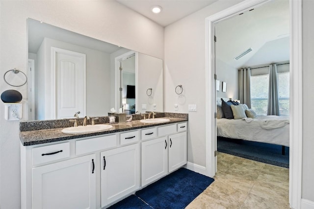 4225 Borho Ranch St, Leander, TX 78641 - ensuite bathroom with double vanity and vaulted ceiling