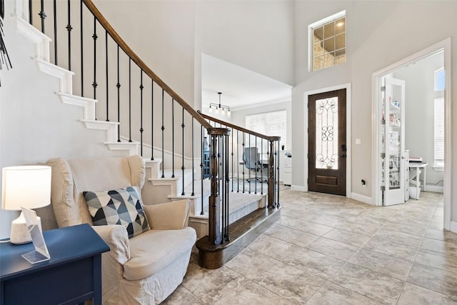 4225 Borho Ranch St, Leander, TX 78641 - foyer entrance with stairway, plenty of natural light, and a towering ceiling