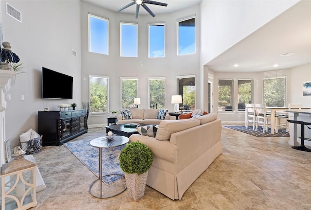 4225 Borho Ranch St, Leander, TX 78641 - living area with plenty of natural light, ceiling fan, a high ceiling, and recessed lighting