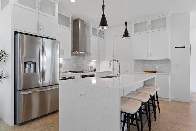 2500 Southland Dr Unit B, Austin, TX 78704 - kitchen featuring stainless steel refrigerator with ice dispenser, wall chimney exhaust hood, decorative backsplash, a kitchen bar, and light countertops