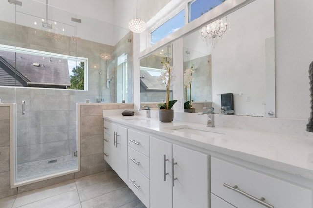 2500 Southland Dr Unit B, Austin, TX 78704 - bathroom with double vanity, a stall shower, tile patterned flooring, and a chandelier