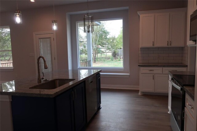 119 Waimanalo Dr, Bastrop, TX 78602 - kitchen featuring electric stove, stainless steel dishwasher, plenty of natural light, dark wood-type flooring, and recessed lighting