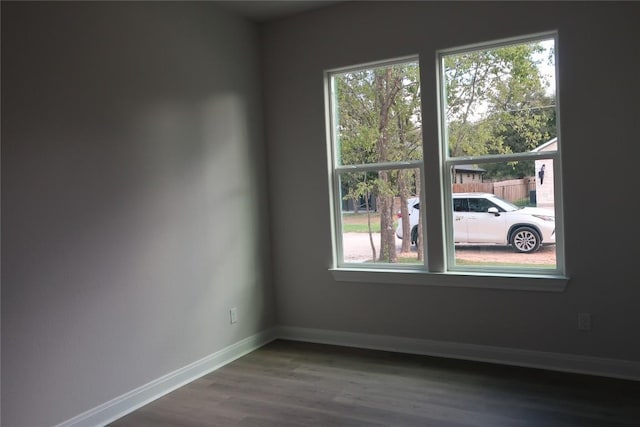 119 Waimanalo Dr, Bastrop, TX 78602 - spare room featuring baseboards and wood finished floors