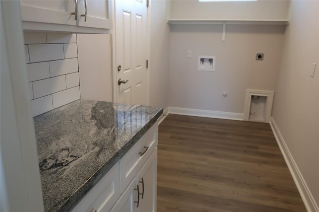 119 Waimanalo Dr, Bastrop, TX 78602 - laundry area with electric dryer hookup, washer hookup, dark wood-style flooring, hookup for a gas dryer, and cabinet space