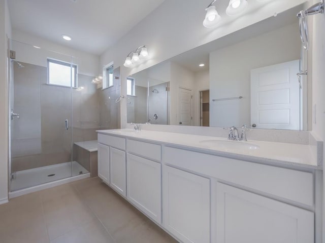 13519 Feldspar Dr, Austin, TX 78729 - full bathroom with tile patterned flooring, a shower stall, and double vanity
