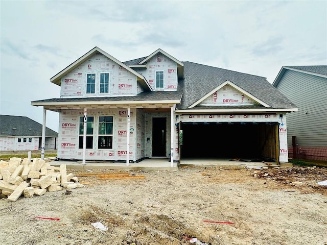 619 Sage Thrasher Cir, Dripping Springs, TX 78620 - property under construction with an attached garage, roof with shingles, covered porch, and driveway