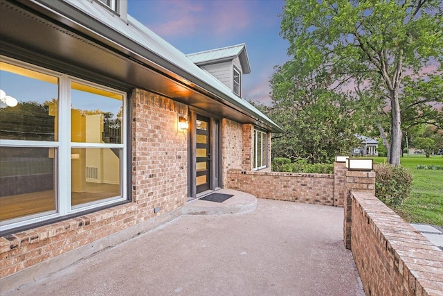 503 Elm St, Bastrop, TX 78602 - patio terrace at dusk with a patio
