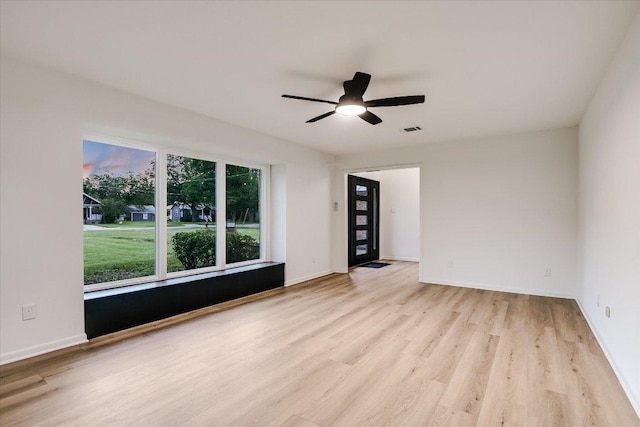 503 Elm St, Bastrop, TX 78602 - spare room featuring light wood-style flooring and a ceiling fan
