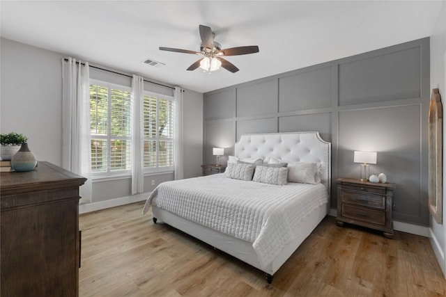 3431 Ranch Park Trl, Round Rock, TX 78681 - bedroom with a decorative wall, light wood-style floors, and ceiling fan