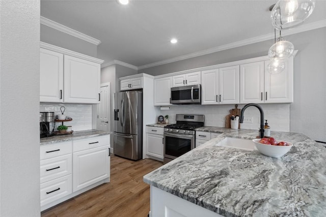 3431 Ranch Park Trl, Round Rock, TX 78681 - kitchen with stainless steel appliances, backsplash, white cabinetry, ornamental molding, and light stone countertops