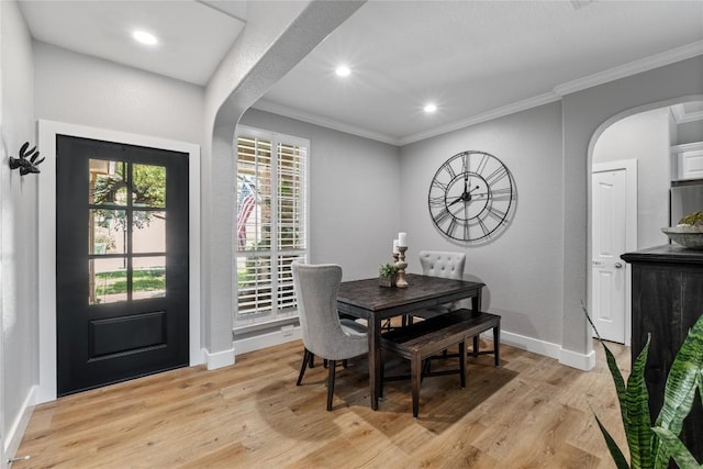 3431 Ranch Park Trl, Round Rock, TX 78681 - dining space featuring arched walkways, light wood-type flooring, crown molding, and recessed lighting