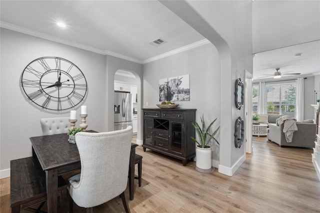 3431 Ranch Park Trl, Round Rock, TX 78681 - dining area with arched walkways, ornamental molding, light wood-style flooring, a ceiling fan, and recessed lighting