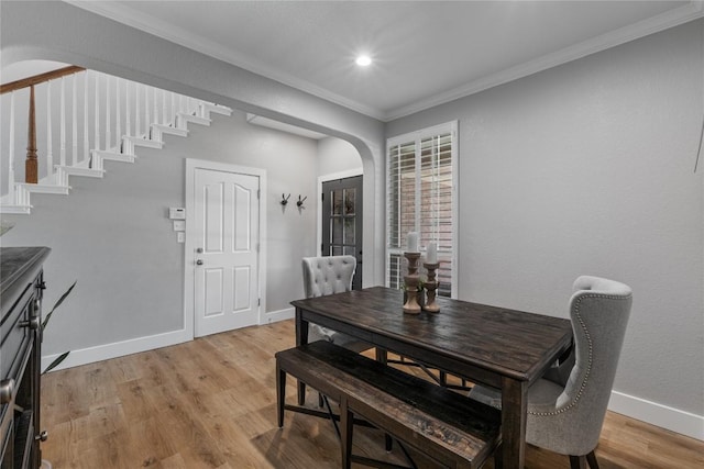 3431 Ranch Park Trl, Round Rock, TX 78681 - dining space with arched walkways, ornamental molding, light wood-type flooring, stairway, and recessed lighting