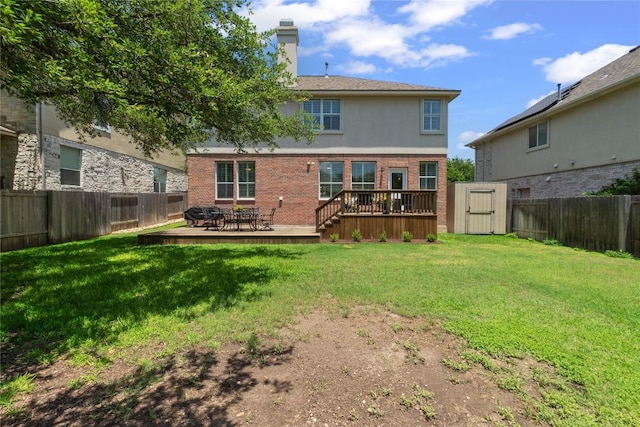 3431 Ranch Park Trl, Round Rock, TX 78681 - rear view of house featuring a deck, a fenced backyard, a chimney, brick siding, and stucco siding