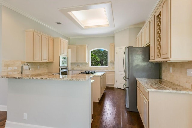 138 Top O The Lake Dr, Lakeway, TX 78734 - kitchen with a peninsula, decorative backsplash, stainless steel appliances, and crown molding