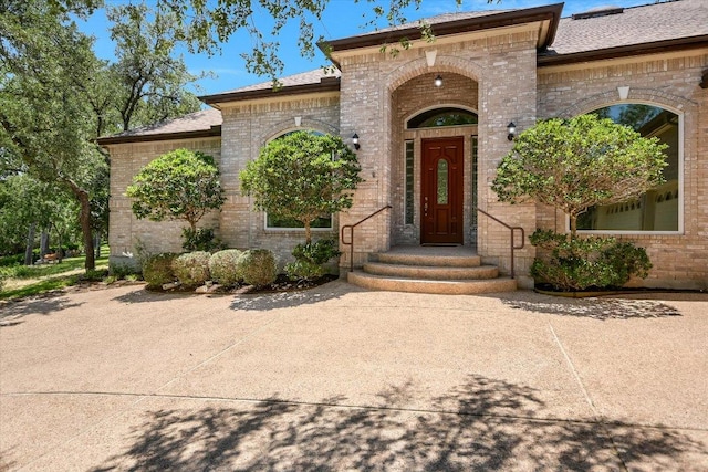 138 Top O The Lake Dr, Lakeway, TX 78734 - entrance to property with brick siding and roof with shingles