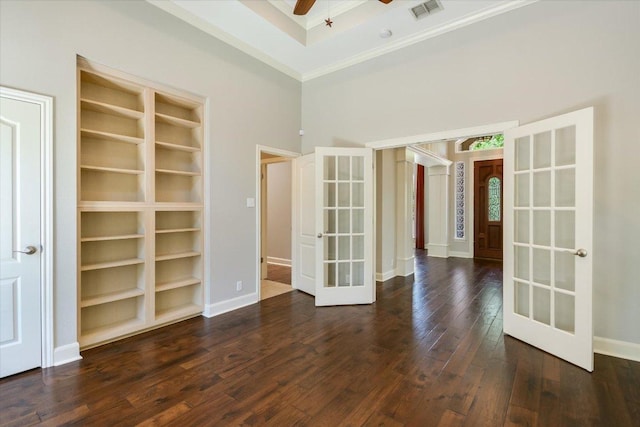 138 Top O The Lake Dr, Lakeway, TX 78734 - empty room featuring french doors, crown molding, dark wood-style floors, ceiling fan, and a high ceiling