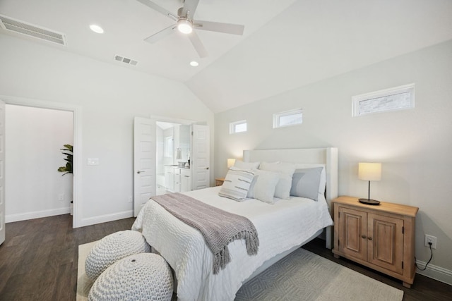 1816 Arapaho Mountain Pass, Leander, TX 78641 - bedroom with dark wood-style flooring, vaulted ceiling, connected bathroom, ceiling fan, and recessed lighting