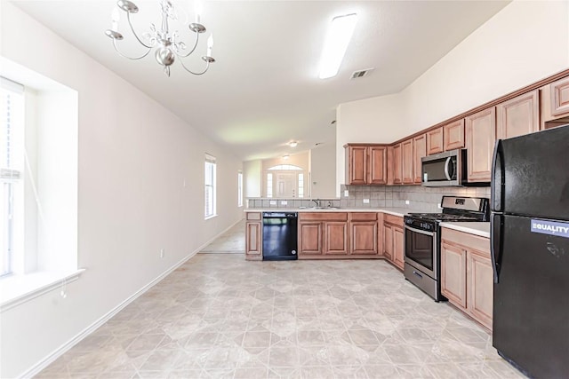 1504 Morning Mist Ln, Pflugerville, TX 78660 - kitchen featuring black appliances, lofted ceiling, light countertops, decorative backsplash, and a chandelier