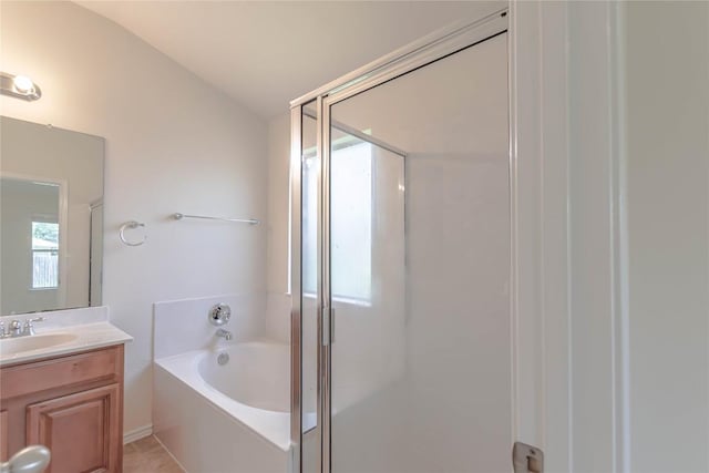 1504 Morning Mist Ln, Pflugerville, TX 78660 - bathroom with a garden tub, vanity, vaulted ceiling, and a shower stall