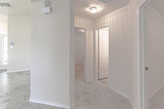 1504 Morning Mist Ln, Pflugerville, TX 78660 - hallway featuring light marble finish floors and baseboards