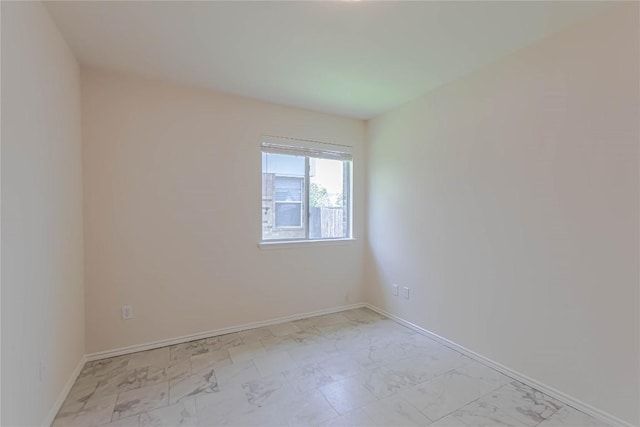 1504 Morning Mist Ln, Pflugerville, TX 78660 - empty room featuring light marble finish flooring and baseboards
