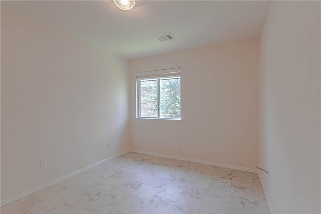 1504 Morning Mist Ln, Pflugerville, TX 78660 - empty room featuring light marble finish floors and baseboards