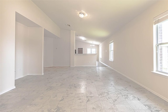 1504 Morning Mist Ln, Pflugerville, TX 78660 - unfurnished living room with lofted ceiling, plenty of natural light, and light marble finish flooring