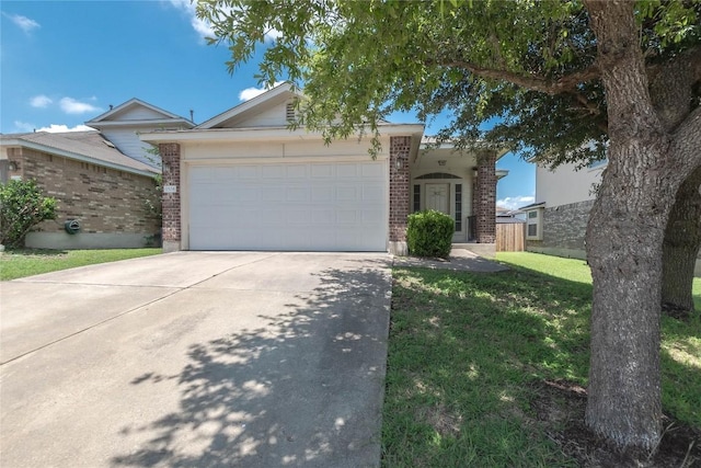 1504 Morning Mist Ln, Pflugerville, TX 78660 - view of front facade with brick siding, a garage, driveway, and a front yard