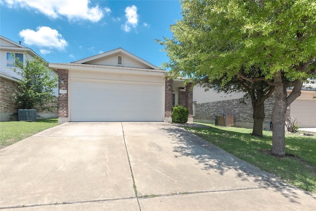 1504 Morning Mist Ln, Pflugerville, TX 78660 - ranch-style house with brick siding, driveway, and a garage