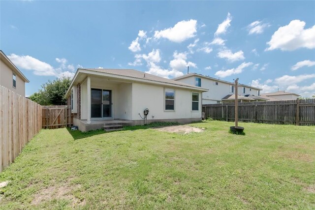 1504 Morning Mist Ln, Pflugerville, TX 78660 - back of property featuring a fenced backyard and stucco siding
