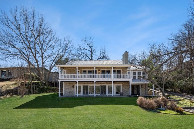 10810 River Terrace Cir, Austin, TX 78733 - rear view of house with a chimney, a lawn, and brick siding