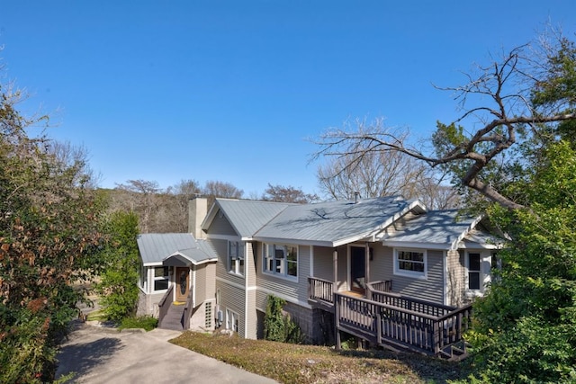 10810 River Terrace Cir, Austin, TX 78733 - view of front facade featuring a chimney and a metal roof