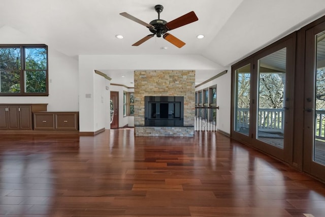 10810 River Terrace Cir, Austin, TX 78733 - unfurnished living room featuring healthy amount of natural light, wood finished floors, lofted ceiling, ceiling fan, and recessed lighting