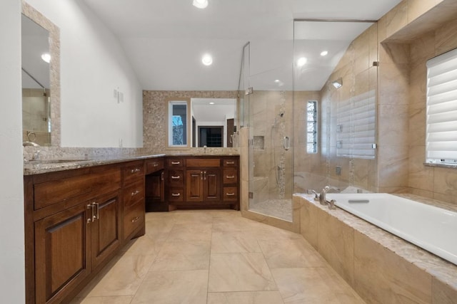 10810 River Terrace Cir, Austin, TX 78733 - bathroom featuring double vanity, a bath, lofted ceiling, and a shower stall