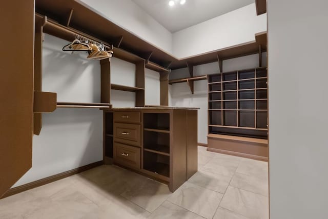 10810 River Terrace Cir, Austin, TX 78733 - walk in closet featuring light marble finish flooring