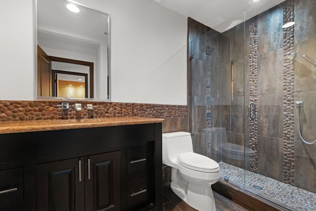 10810 River Terrace Cir, Austin, TX 78733 - full bath with a stall shower, vanity, tile walls, and recessed lighting