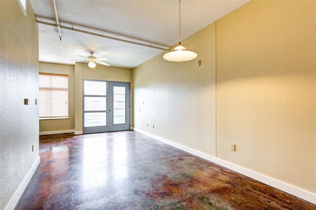 711 W 26th St Unit 504, Austin, TX 78705 - spare room featuring a textured wall, a ceiling fan, and concrete floors