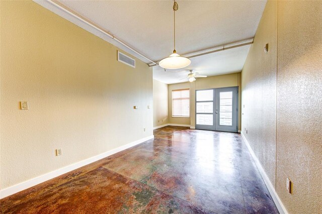 711 W 26th St Unit 504, Austin, TX 78705 - empty room with finished concrete floors and ceiling fan