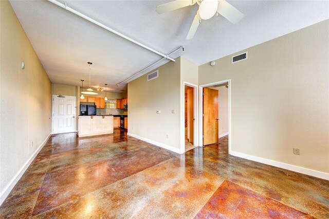 711 W 26th St Unit 504, Austin, TX 78705 - unfurnished living room with finished concrete floors and ceiling fan