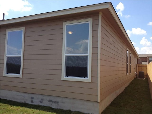 13701 Abraham Lincoln St, Manor, TX 78653 - view of side of home with a central AC unit