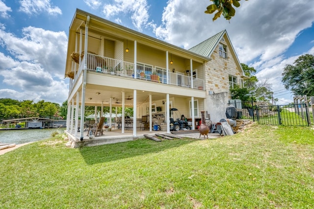 134 Glen Oaks Dr, Sunrise Beach, TX 78643 - rear view of property with a balcony, a patio area, ceiling fan, a water view, and a metal roof