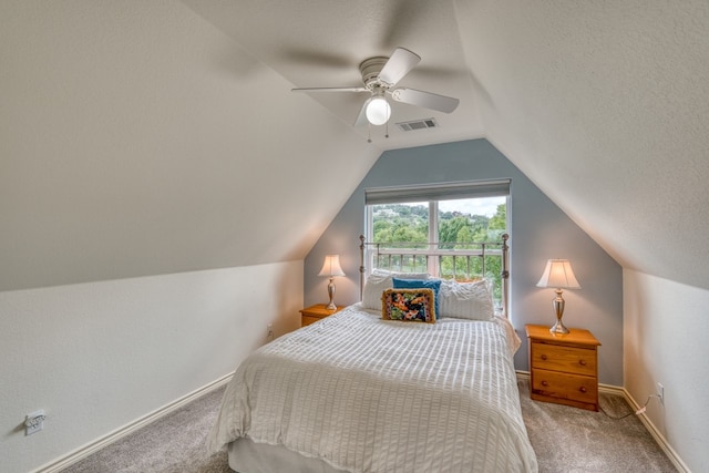 134 Glen Oaks Dr, Sunrise Beach, TX 78643 - bedroom featuring carpet, vaulted ceiling, and ceiling fan