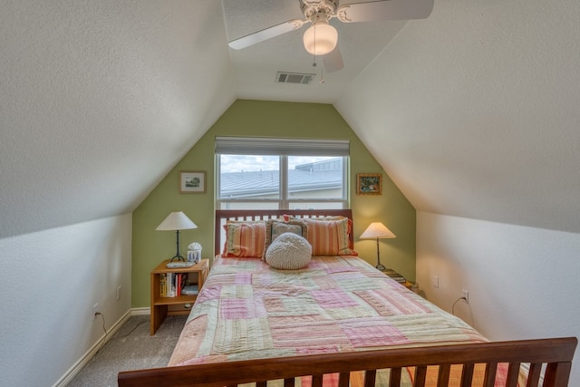 134 Glen Oaks Dr, Sunrise Beach, TX 78643 - bedroom with light carpet, vaulted ceiling, and a ceiling fan