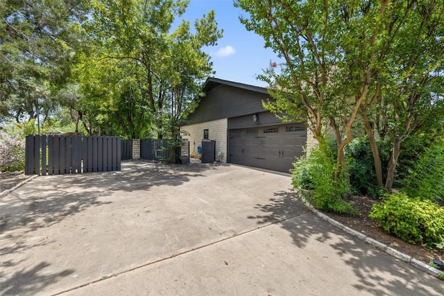 103 Schooner Dr, Lakeway, TX 78738 - view of property exterior featuring concrete driveway and a garage