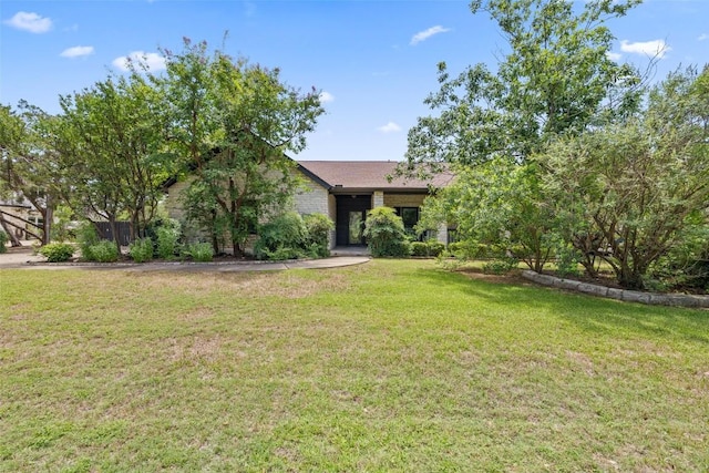 103 Schooner Dr, Lakeway, TX 78738 - view of front of property with a front lawn and brick siding