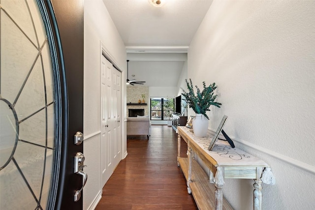 103 Schooner Dr, Lakeway, TX 78738 - entryway featuring dark wood-style flooring, a large fireplace, and a ceiling fan