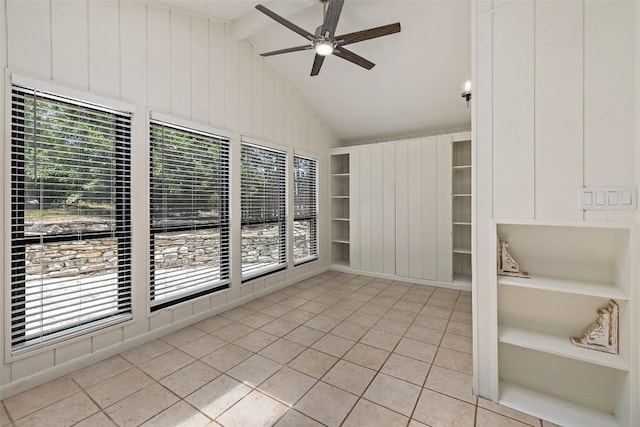 103 Schooner Dr, Lakeway, TX 78738 - unfurnished room featuring light tile patterned floors, a ceiling fan, healthy amount of natural light, built in features, and wooden walls